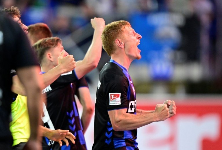 Paderborn's Laurin Curda scored in extra-time to grab a 2-1 home win in the second relegation playoff leg on Monday and relegate 2009 Bundesliga champions Wolfsburg 2-1 on aggregate. 