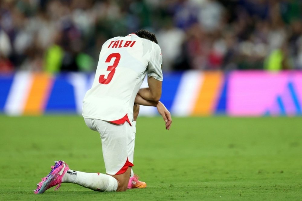 Tunisia's dejected players