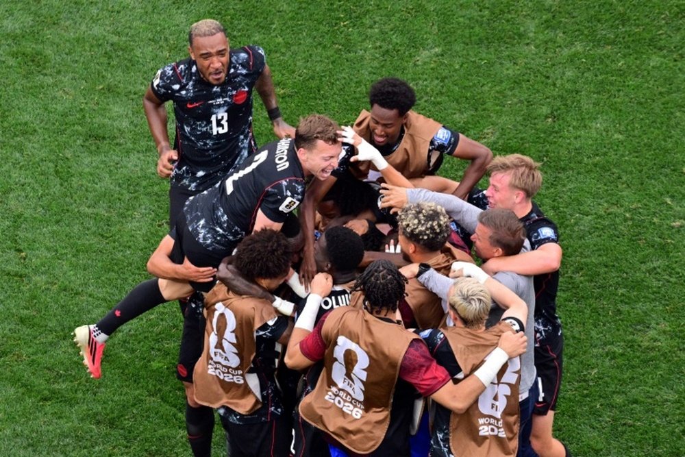 Canada's bench streamed onto the pitch as the stadium eruped AFP Frederic J. Brown