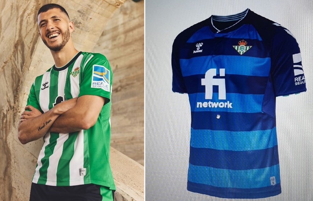 Guido Rodríguez posa con la primera equipación del Real Betis para la próxima campaña 2022-23, junto a un boceto de la segunda. (RBB)