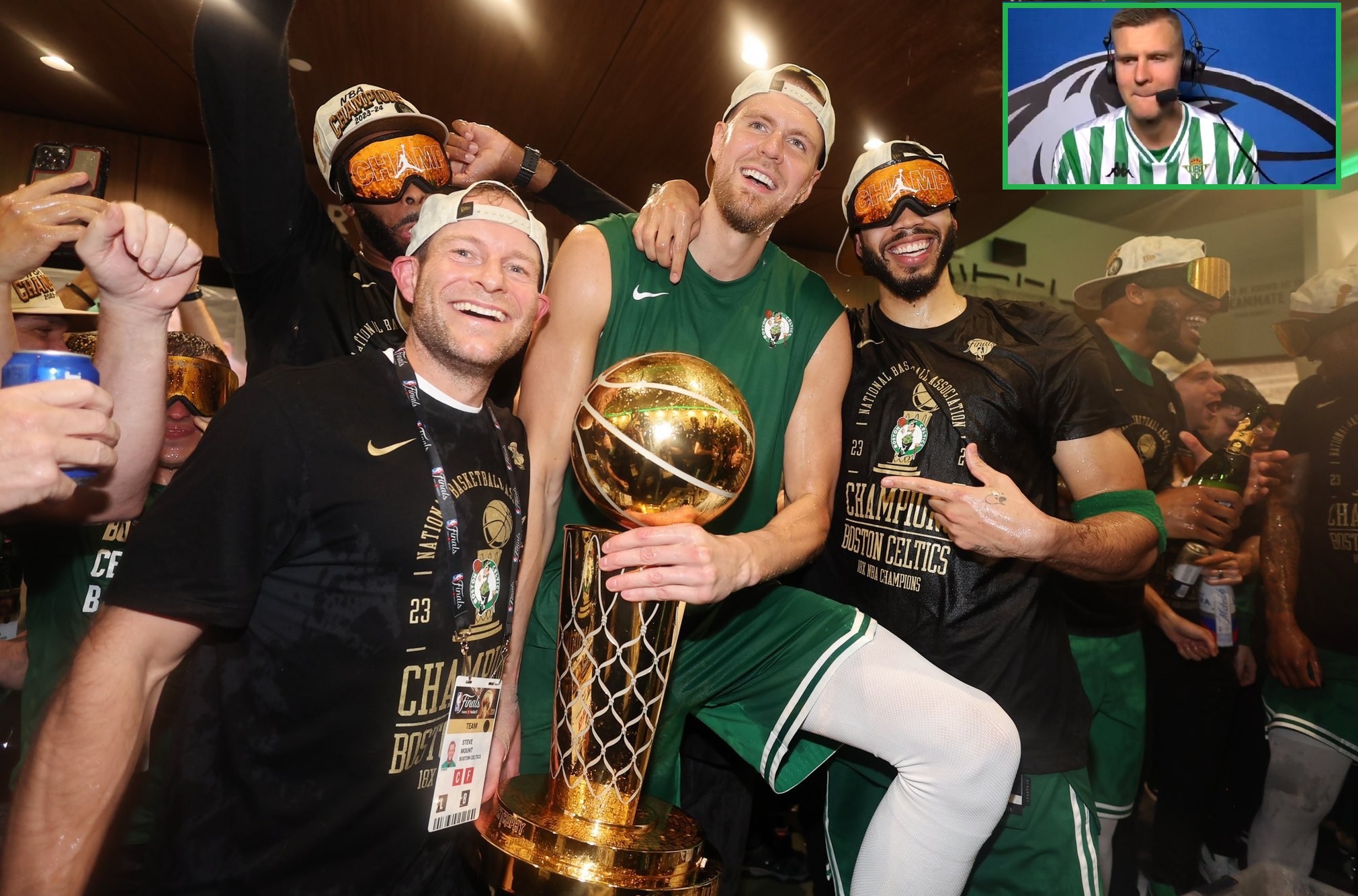 Porzingis, que ha ido a ruedas de prensa de la NBA con la camiseta del Real Betis, celebra el anillo con sus compañeros de los Celtics.- Efe