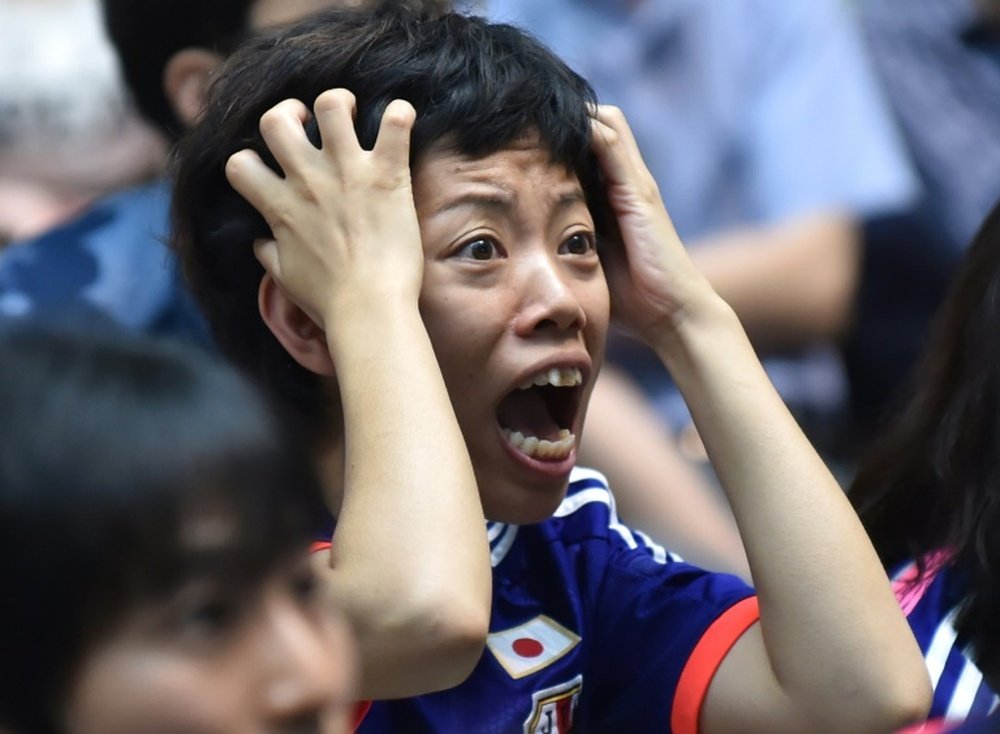 A Japanese football fan reacts as she watches the Women World Cup final between Japan and the US at a public screening in Tokyo on July 6, 2015