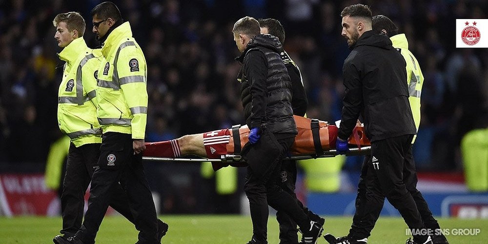 Aberdeen defender Andrew Considine left the field with a neck injury. Twitter/AberdeenFC