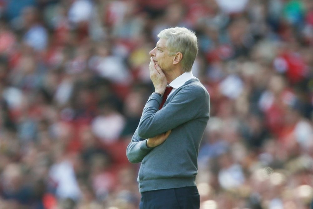 Wenger is paid £8.5m per year. AFP
