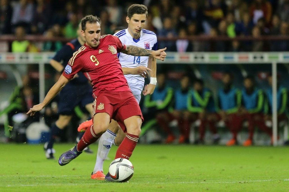 Spains Paco Alcacer (L) scores a goal during their Euro 2016 qualifying match against Luxembourg, at Las Gaunas stadium in Logrono, on October 9, 2015