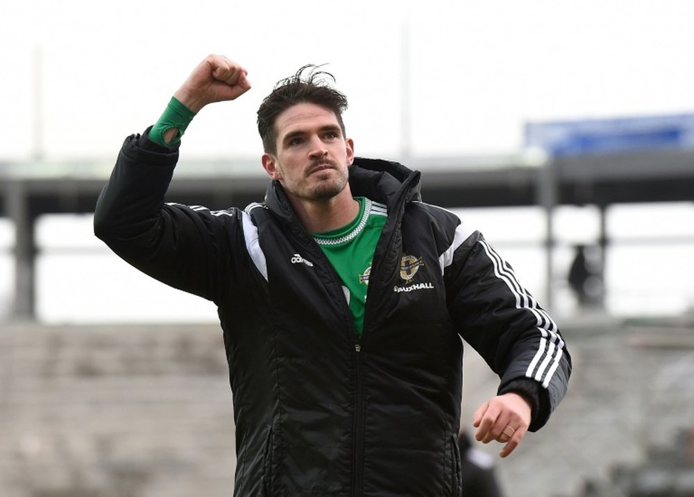Northern Irelands striker Kyle Lafferty celebrates on the pitch after the Euro 2016 qualifying football match between Northern Ireland and Finland at Windsor Park, Belfast on March 29, 2015