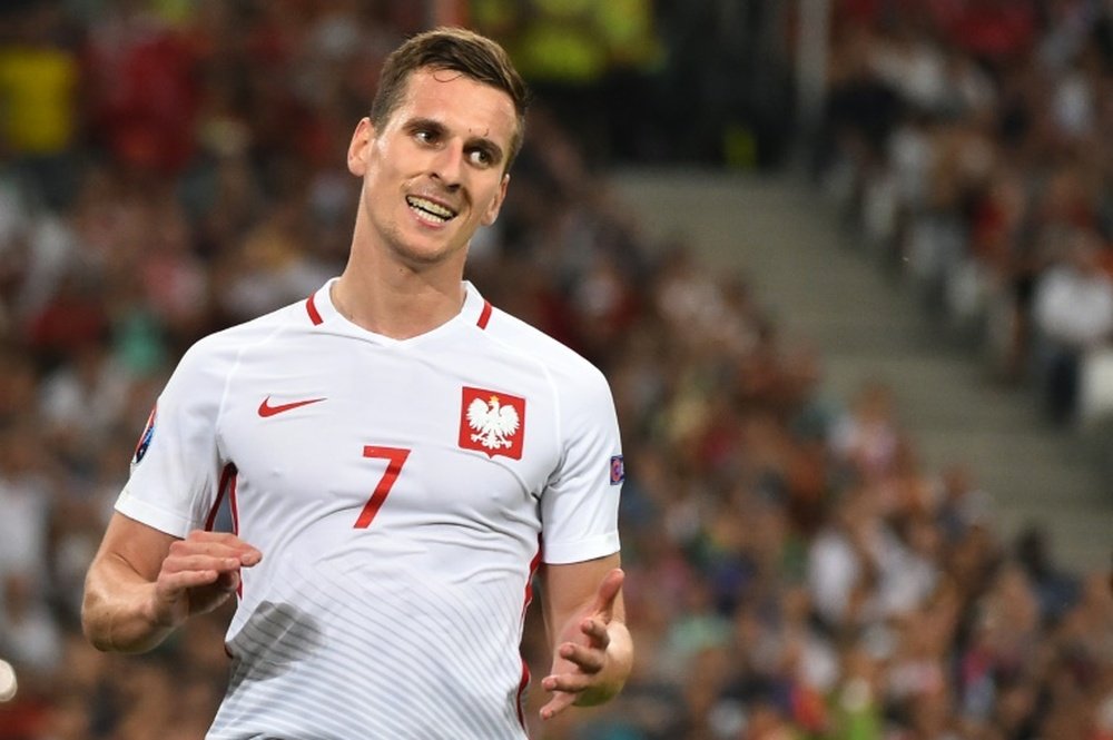 Polands forward Arkadiusz Milik reacts during the Euro 2016 quarter-final football match between Poland and Portugal at the Stade Velodrome in Marseille on June 30, 2016