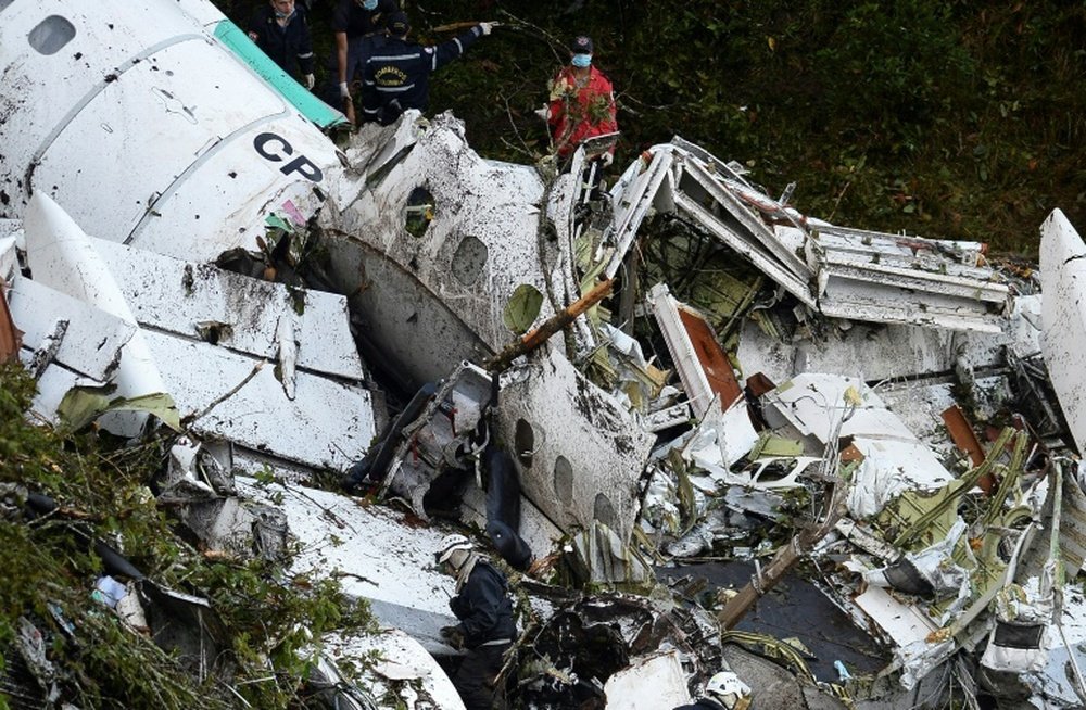 Rescue teams work on the recovery of bodies of victims of the crash in Colombia. AFP