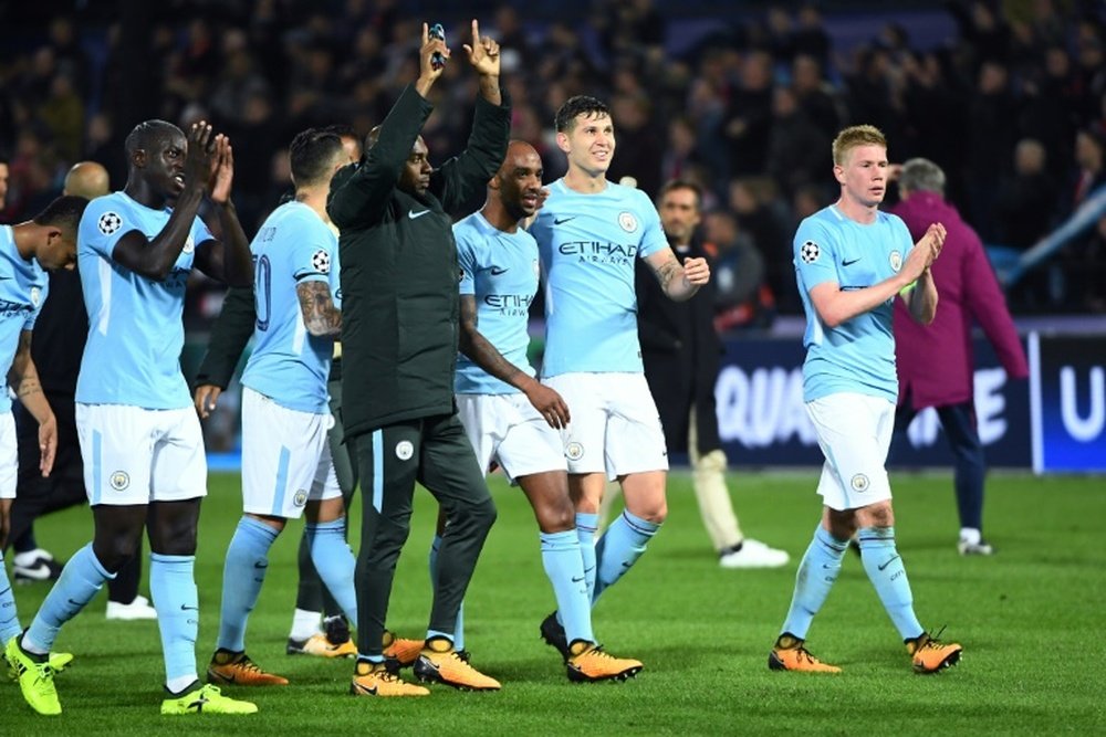 City's players celebrate after winning against Feyenoord in the Champions League. AFP
