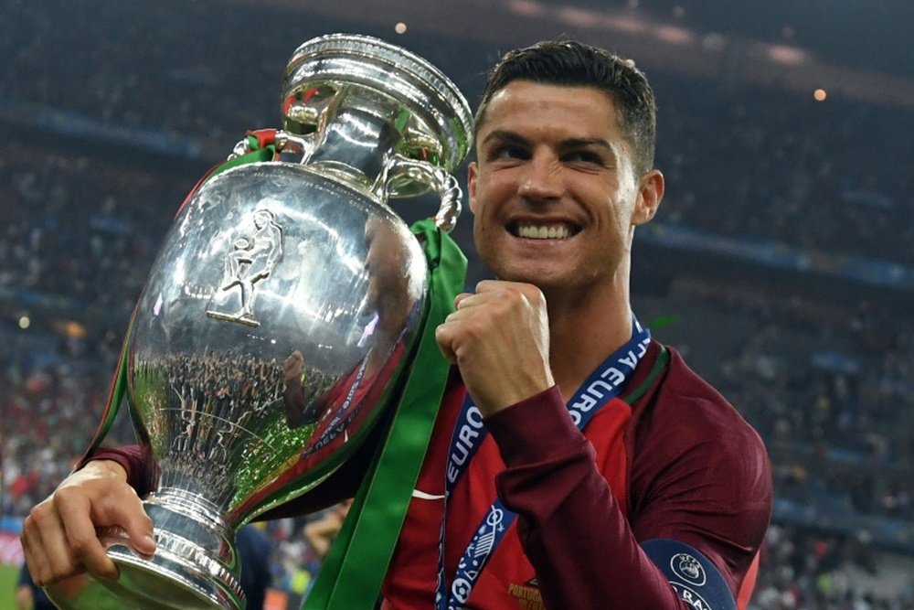 Portugals Cristiano Ronaldo poses with the trophy after Portugal won the Euro 2016 final. BeSoccer