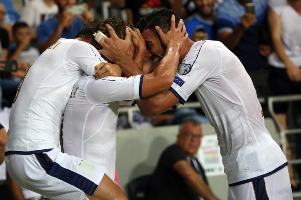 Italys forward Graziano Pelle (R) and teammates celebrate scoring against Israel on September 5, 2016