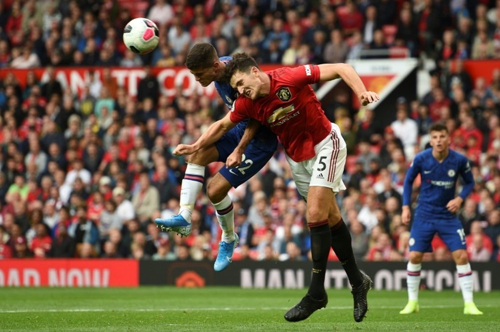 Harry Maguire's performance sparks hard criticism from Roy Keane. AFP