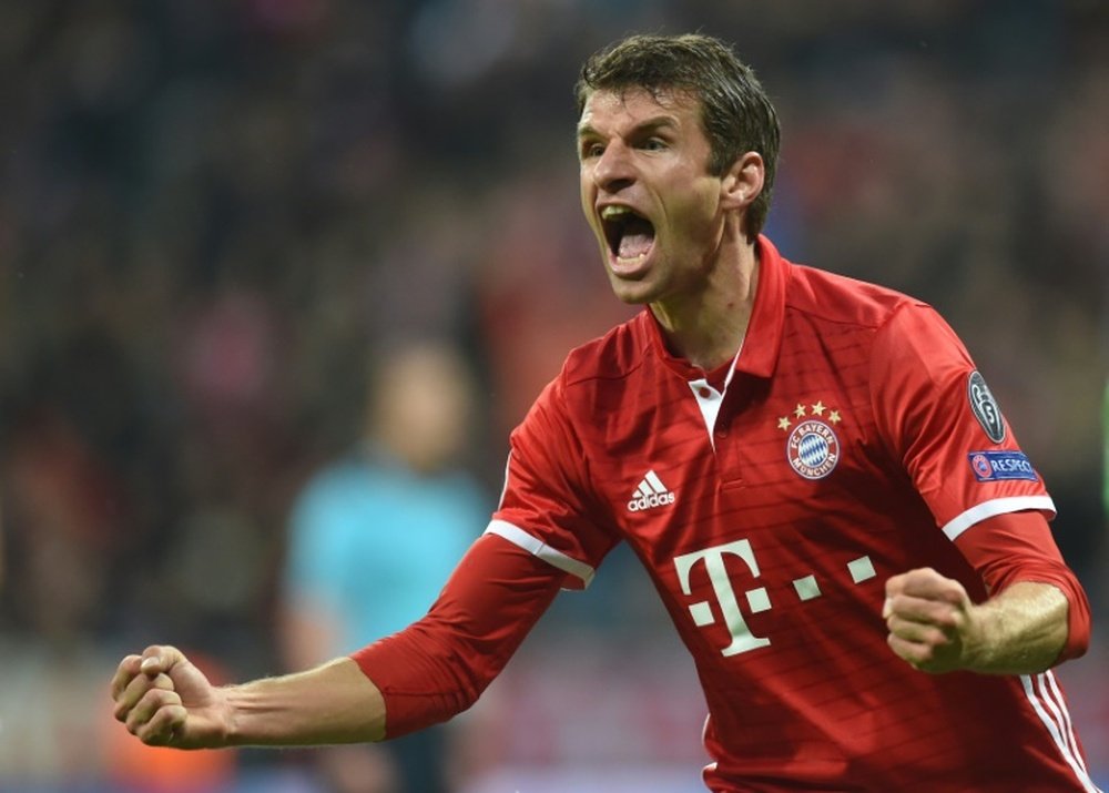 Bayern Munichs striker Thomas Mueller celebrates after the first goal during the UEFA Champions League group D football match FC Bayern Munich vs PSV Eindhoven in Munich, on October 19, 2016