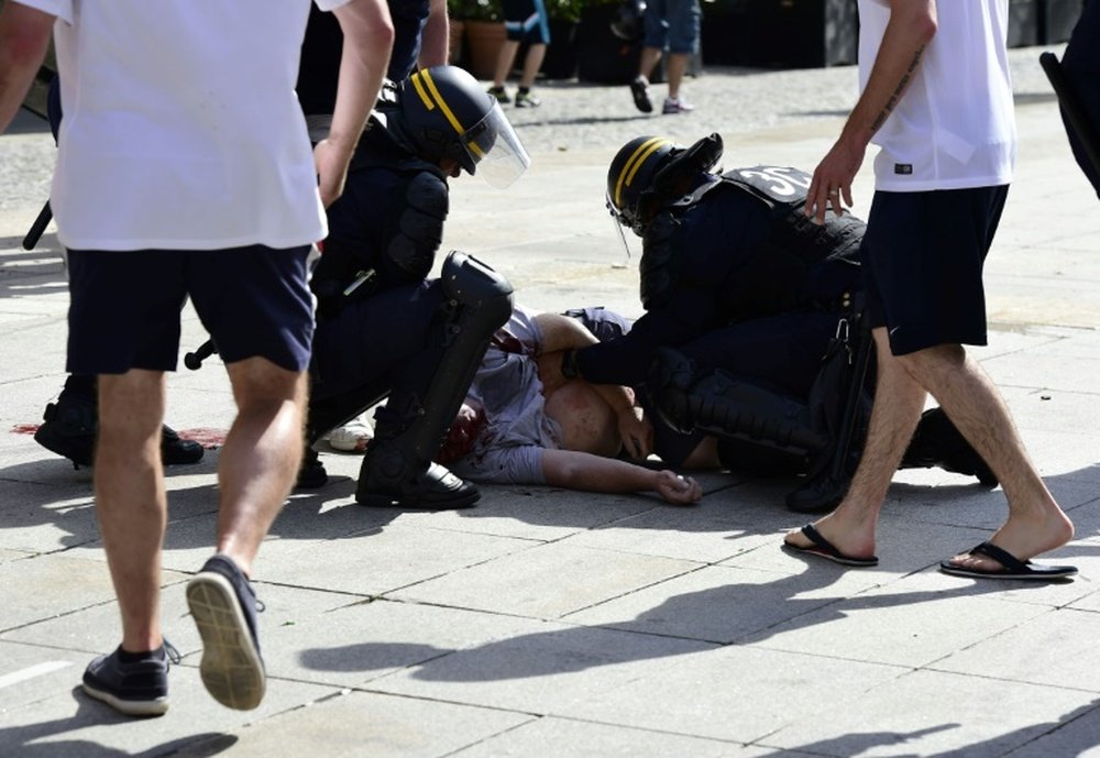 A Russian has been arrested for the sickening attack on an England fan. AFP