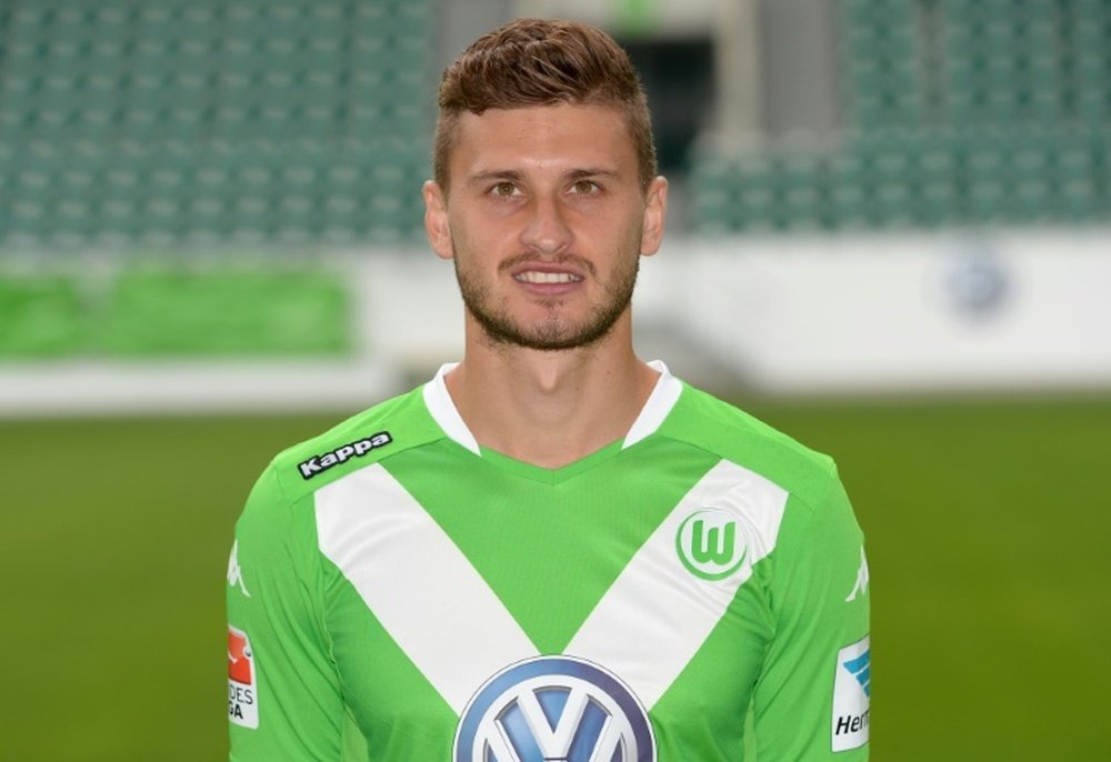 Wolfsburgs Polish midfielder Mateusz Klich poses for a photograph during the official presentation of German first division Bundesliga football team VfL Wolfsburg in Wolfsburg, central Germany on July 30, 2014