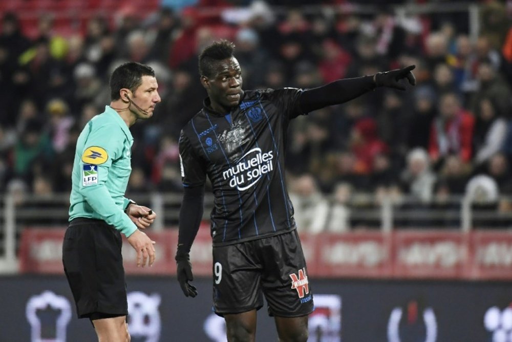 Mario Balotelli saw himself booked after complaining of racial abuse at Dijon. AFP