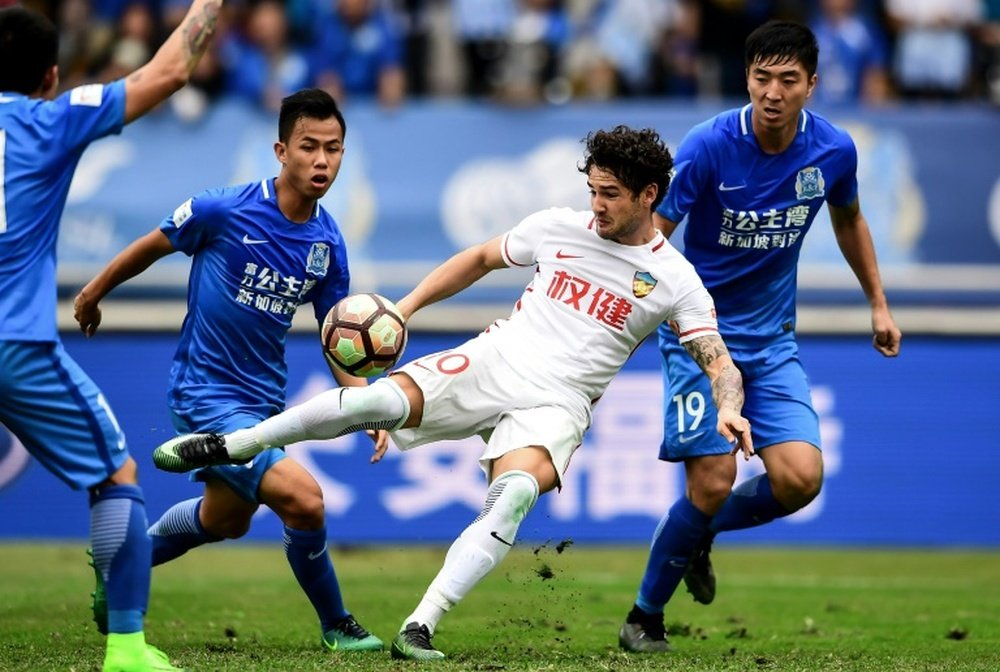 Pato is rediscovering his love for football in China. AFP