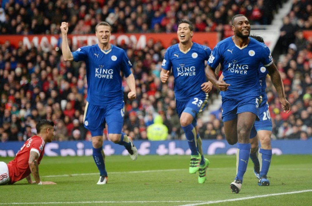 Leicester Citys defender Wes Morgan (R) celebrates scoring a goal during the English Premier League football match between Manchester United and Leicester City at Old Trafford in Manchester, England, on May 1, 2016