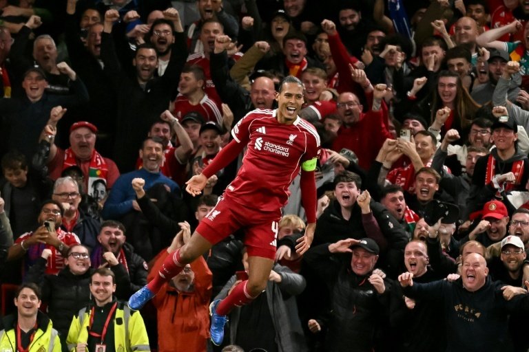 Van Dijk’s late header hands Liverpool dramatic win over Atletico. AFP