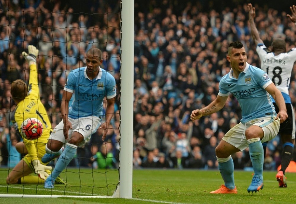 Manchester Citys Sergio Aguero (R) celebrates after scoring a goal during their English Premier League match against Newcastle United, at the Etihad Stadium in Manchester, on October 3, 2015