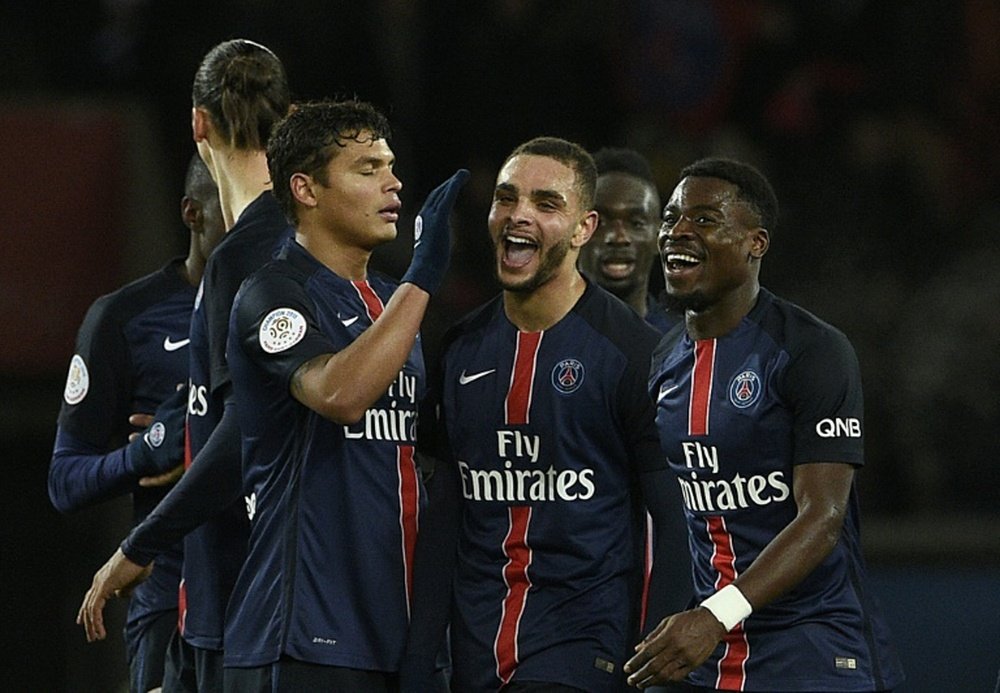 Paris Saint-Germains players celebrate after scoring a goal during their French Ligue 1 match against Lorient, at the Parc des Princes stadium in Paris, on February 3, 2016