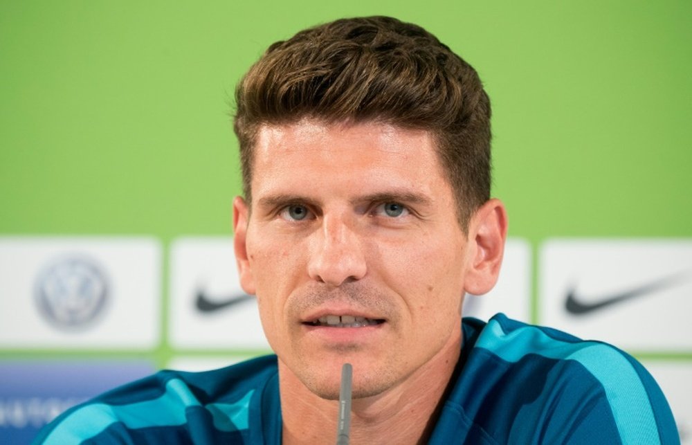 New VfL Wolfsburgs player Mario Gomez attends a press conference on August 18, 2016 during an official presentation in Wolfsburg