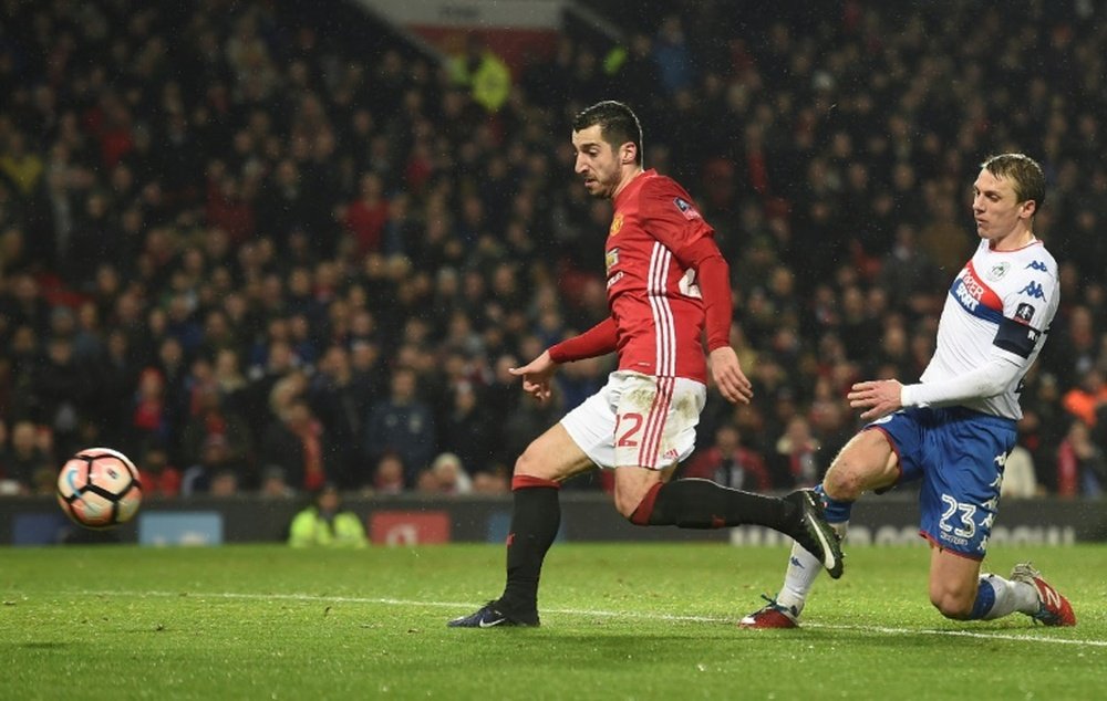 Manchester United's Henrikh Mkhitaryan limps out after match. AFP