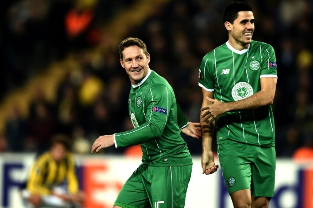 Celtics Kris Commons (L) and Tom Rogic celebrate after scoring a goal during an UEFA Europa League match in Istanbul, in December 2015