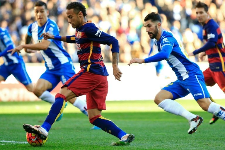 Barcelonas Brazilian forward Neymar (L) controls the ball during the Spanish league football match RCD Espanyol vs FC Barcelona atÂ the Power8 stadium in Cornella de Llobregat on January 2, 2016