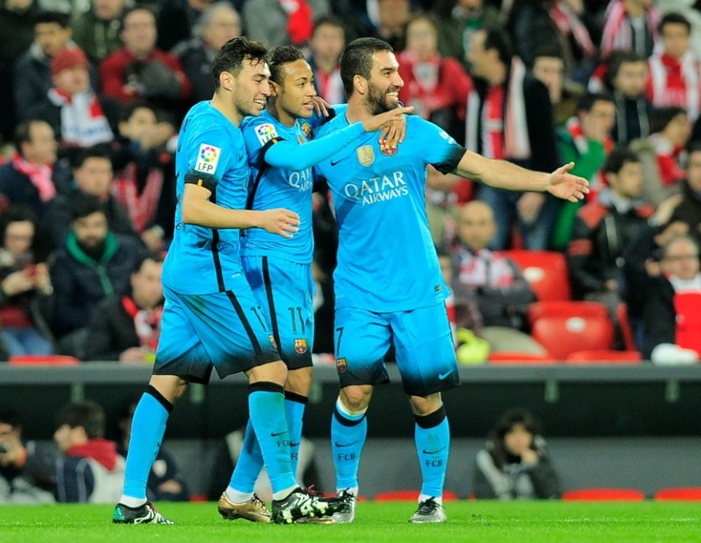 Barcelonas Neymar da Silva Santos Junior (C) celebrates a goal with forward Munir El Haddadi (L) and midfielder Arda Turan during the Spanish Copa del Rey (Kings Cup) football match at the San Mames stadium in Bilbao on January 20, 2016