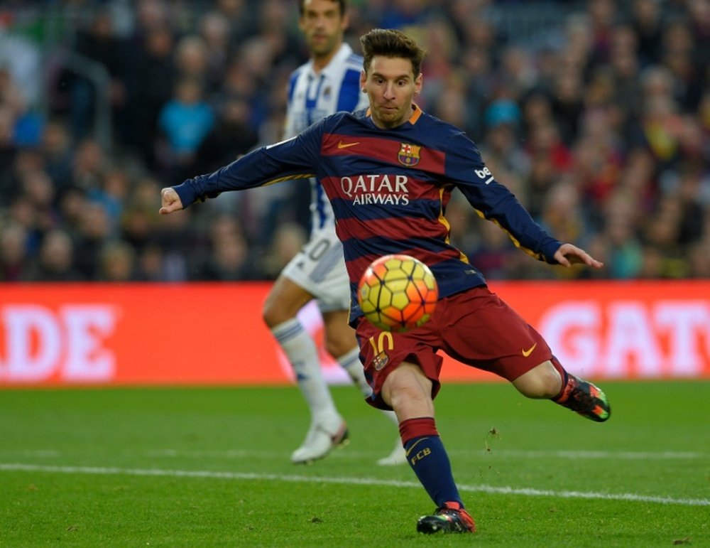 Barcelonas Argentinian forward Lionel Messi kicks the ball during the Spanish league football match FC Barcelona vs Real Sociedad de Futbol at the Camp Nou stadium in Barcelona on November 28, 2015