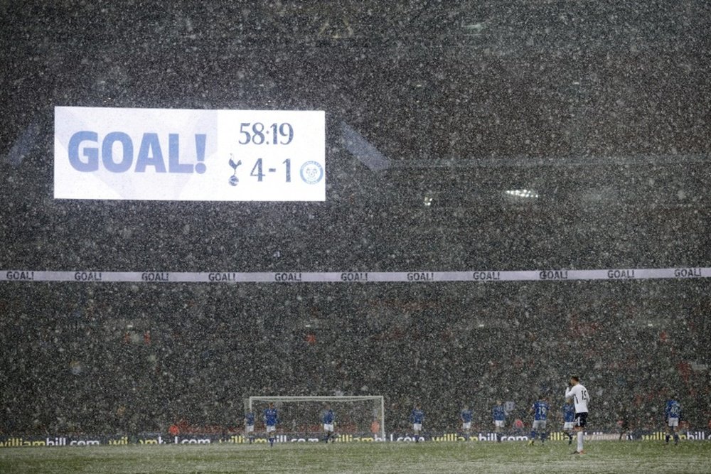 Tottenham won in snowy conditions. AFP