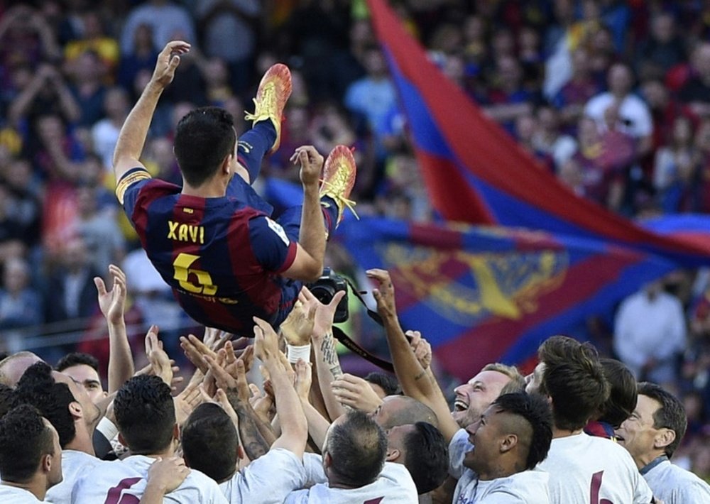 Todos escolheram Xavi como o melhor meia da história do Barça. AFP