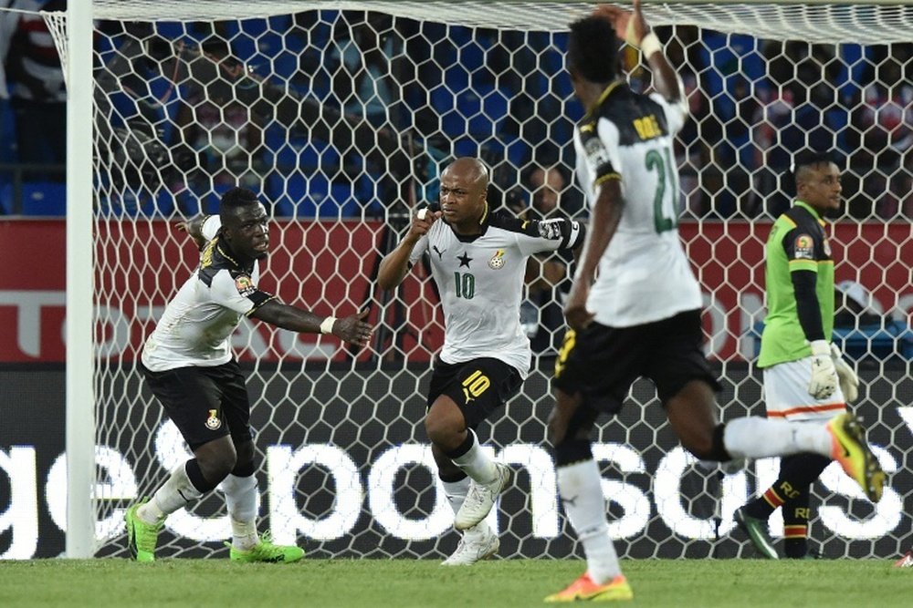 Ghana forward Andre Ayew (no. 10) celebrates with team-mates after scoring. AFP