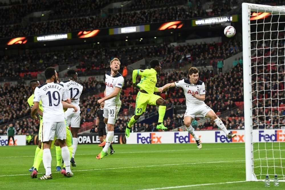 Harry Kane (C) watches as his defensive header goes into his own goal