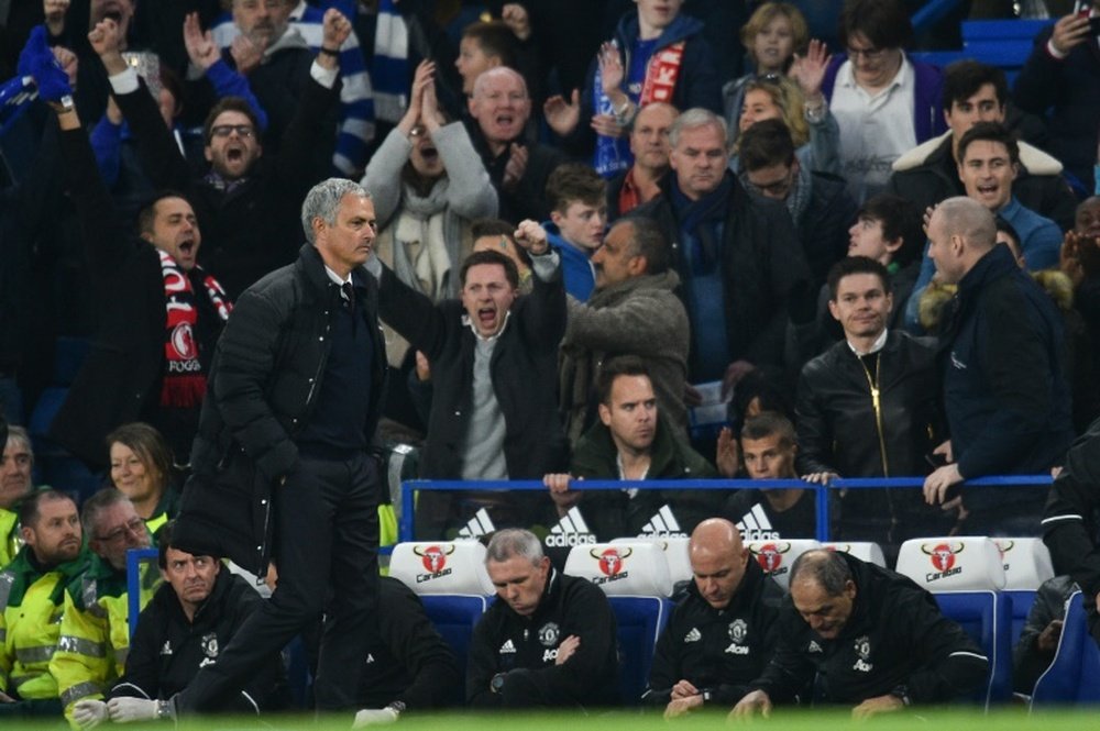 Manchester United manager Jose Mourinho starts walking toward the tunnel at the final whistle. AFP