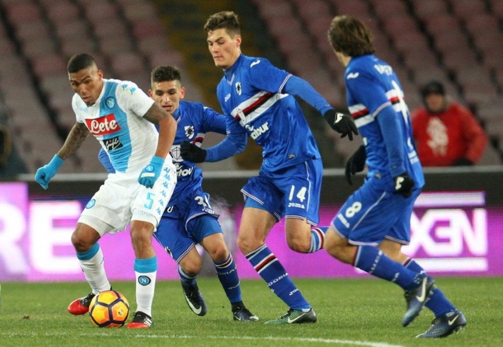 Napoli's midfielder Allan (L) fights for the ball with Sampdoria's forward Patrik Schick (C) during the Italian Serie A football match January 7, 2017