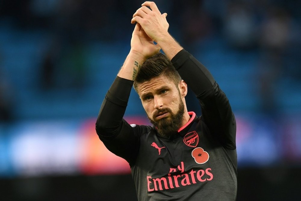 Giroud will consider leaving Arsenal in January. AFP