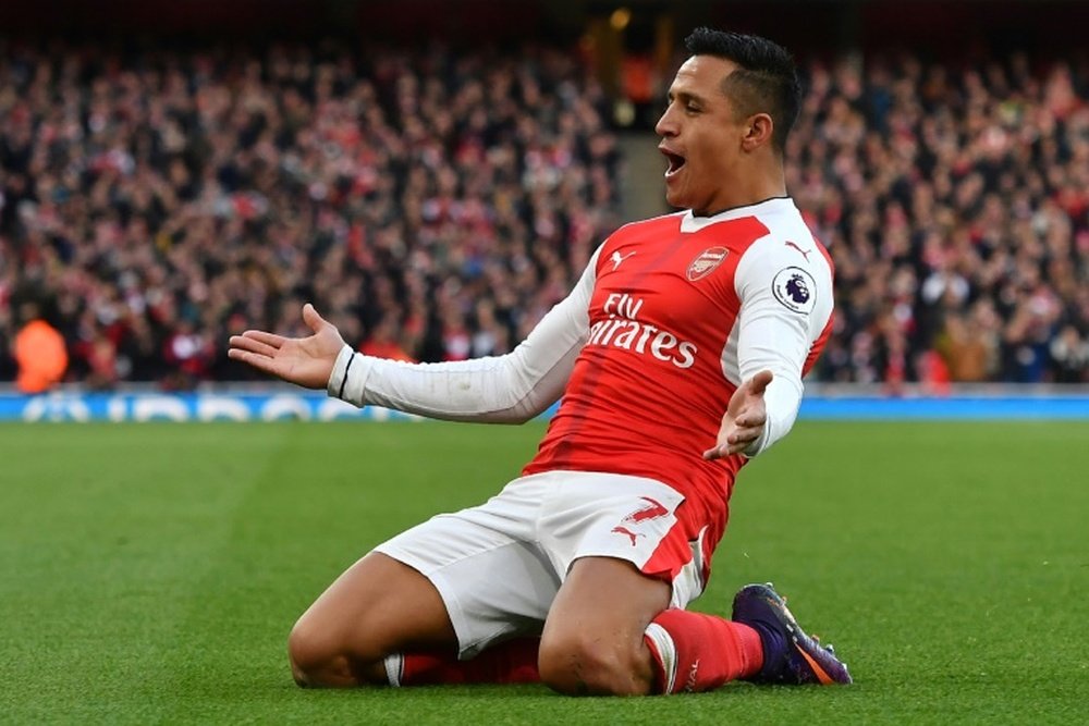 Arsenals Sanchez celebrates scoring the opening goal in his teams 3-1 win over Bournemouth. AFP