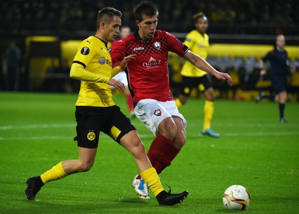Borussia Dortmund loan midfielder Adnan Januzaj vies with Qabalas Vojislav Stankovic during their UEFA Europa League match in Dortmund, western Germany on November 5, 2015