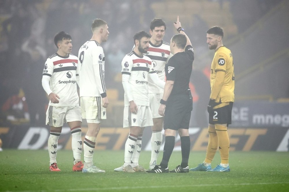 Bruno Fernandes (C) was sent-off in Manchester United's 2-0 defeat at Wolves. AFP