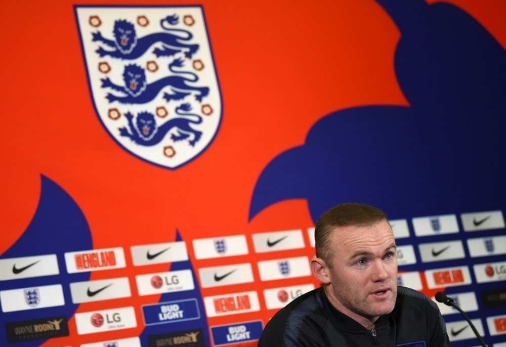 Rooney will return to England duty. AFP