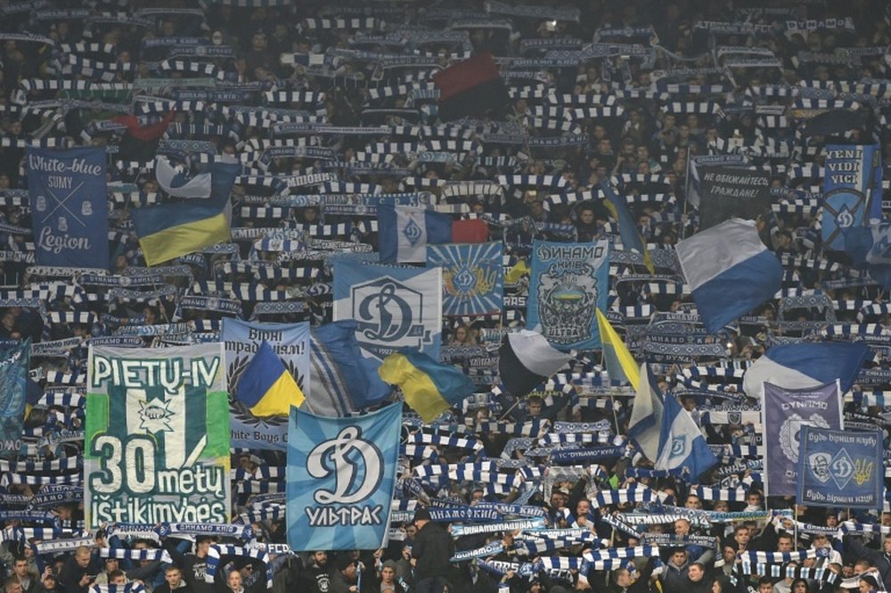 Kiev supporters cheer their team during the UEFA Champions League football match Dynamo Kiev vs Chelsea at the Olympic stadium in Kiev on October 20, 2015