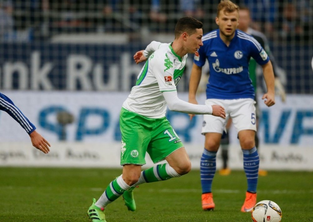 Wolfsburgs midfielder Julian Draxler (L) playing against FC Schalke, a game his team went on to lose, prompting fans to boo them