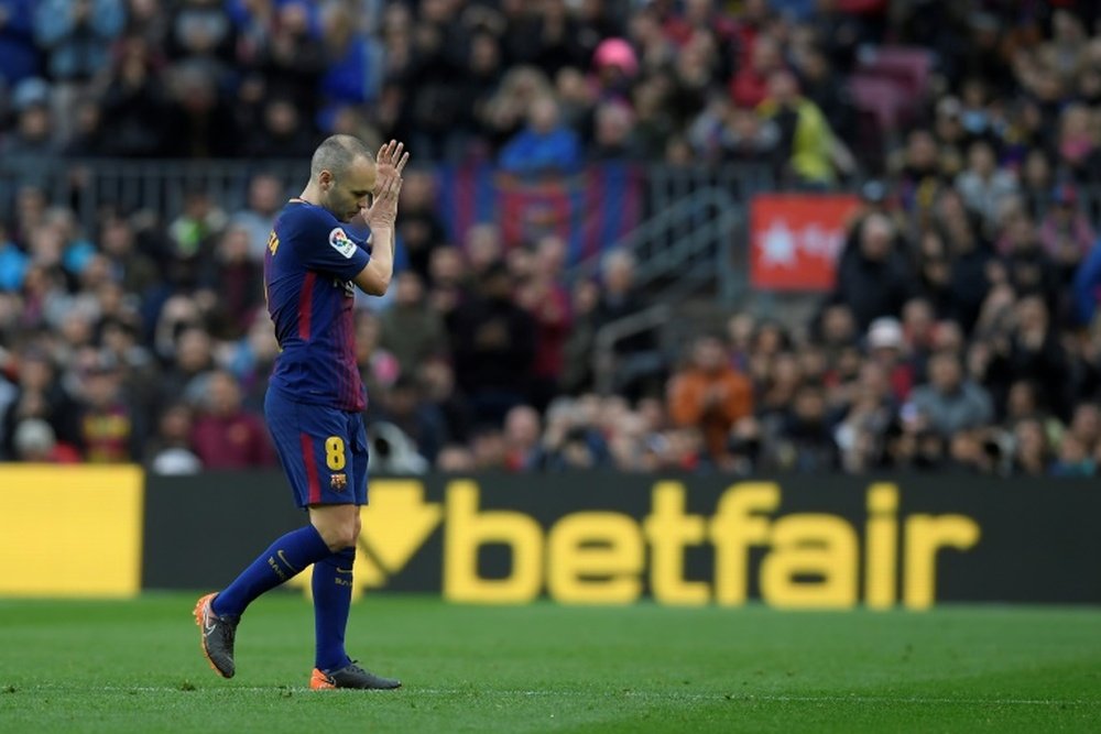 Iniesta hobbled off with a hamstring problem against Atletico. AFP