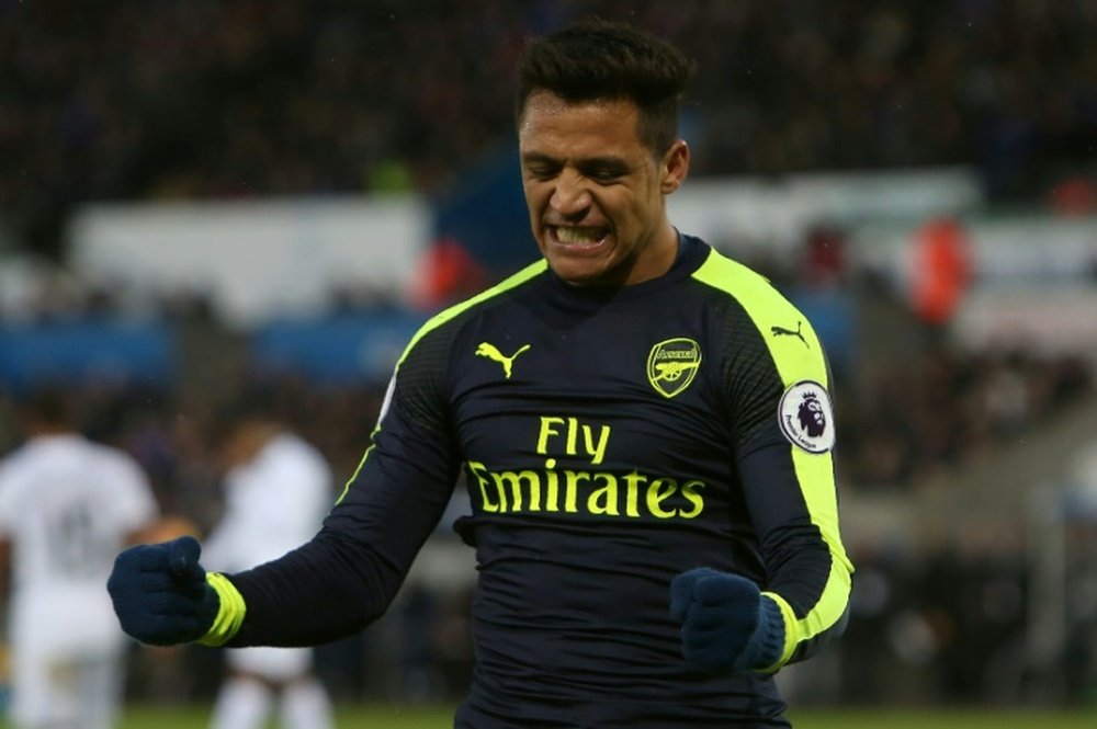 Alexis Sanchez scored the last of Arsenals four goals against Swansea but appeared far from happy when he was taken off in the final quarter