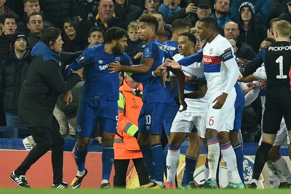 Everton and Lyon players clash in the reverse fixture at Goodison Park. AFP