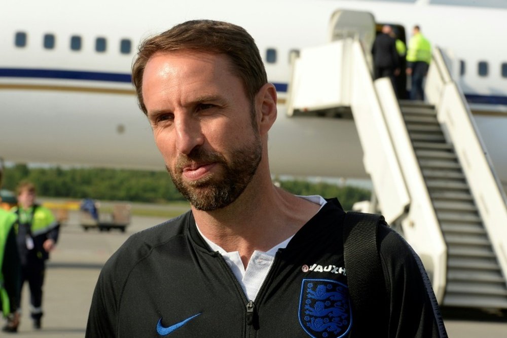 Southgate and his men arrive ahead of their first group match on Monday 18th. AFP