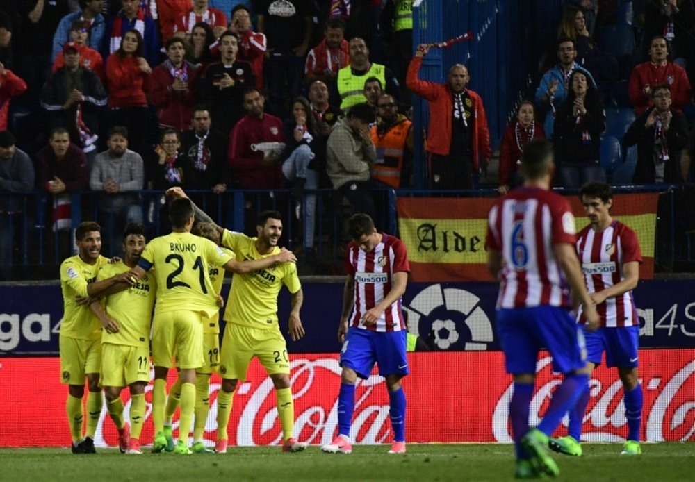 Villarreals players celebrate after midfielder Roberto Soriano scored