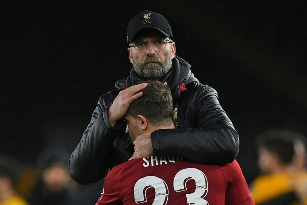 Jurgen Klopp with Xherdan Shaqiri. AFP